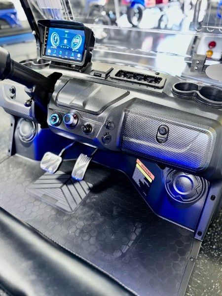 A close up of the dashboard of a golf cart.