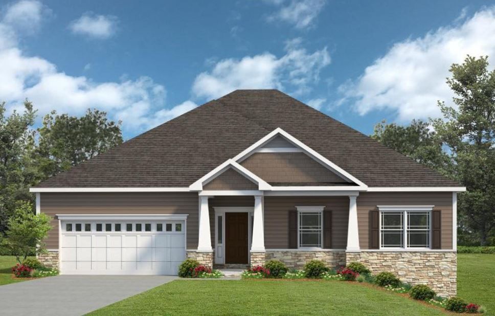 a house with a brown roof and a white garage door
