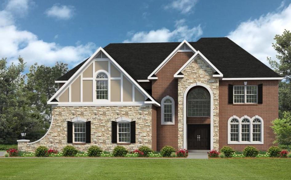 a large brick and stone house with a black roof