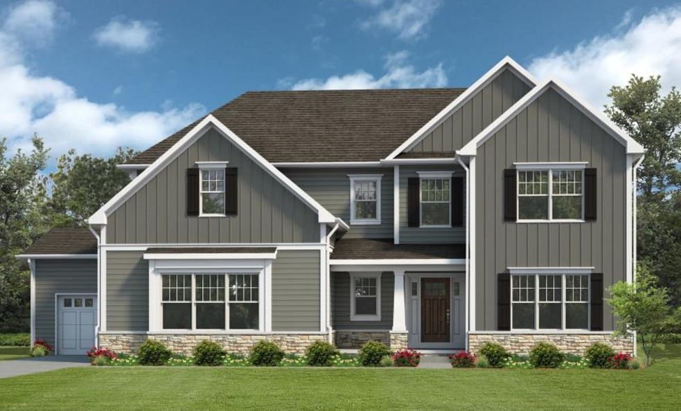 a large house with a lot of windows and shutters is sitting on top of a lush green lawn .