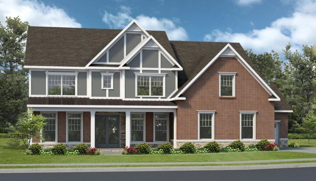 a large brick house with a brown roof and white trim