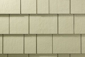 A close up of a white siding on a house.