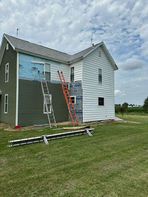 A house with a ladder on the side of it.