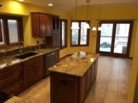 There is a large island in the middle of the kitchen.