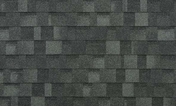 A close up of a roof shingle with a checkered pattern.