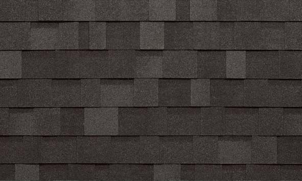 A close up of a row of black tiles on a roof.