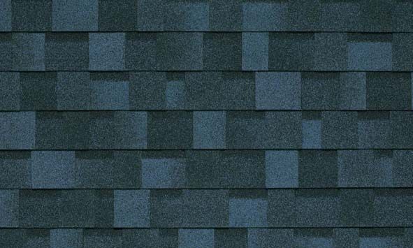 A close up of a row of blue shingles on a roof.