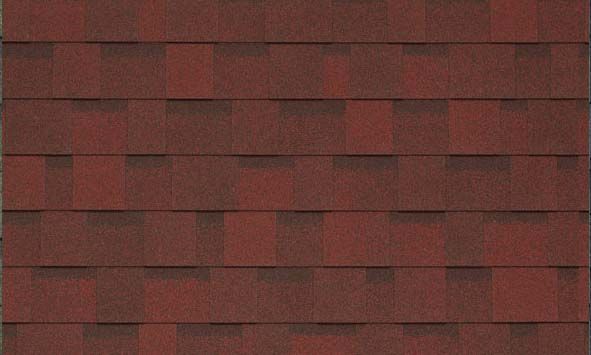 A close up of a red roof shingle.
