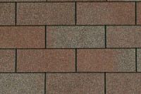 A close up of a brick wall with a brick pattern.