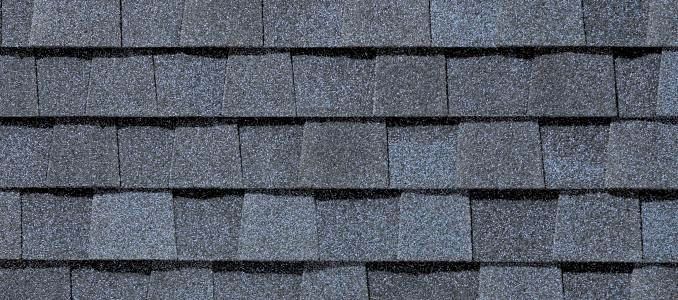 A close up of a roof with a lot of shingles on it.