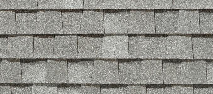 A close up of a gray shingle roof.