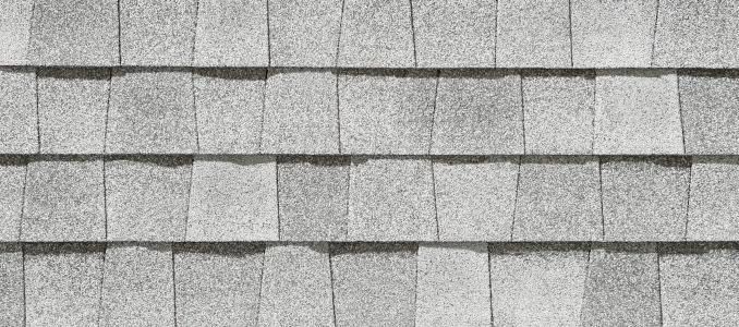 A close up of a roof with shingles on it.