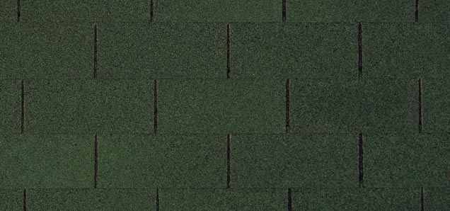 A close up of a green roof shingle.