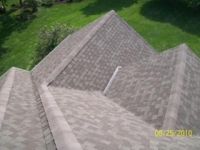 An aerial view of a roof with a lot of shingles on it.