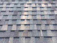 A close up of a roof with shingles on it.