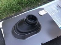 A black object is sitting on top of a table.