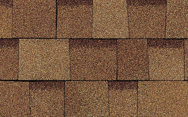 A close up of a roof with shingles on it.