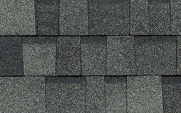 A close up of a roof with shingles on it.