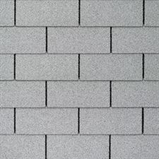 A close up of a gray brick wall.