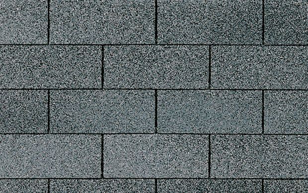 A close up of a gray brick wall.