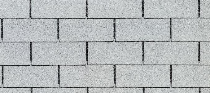 A close up of a white brick wall.