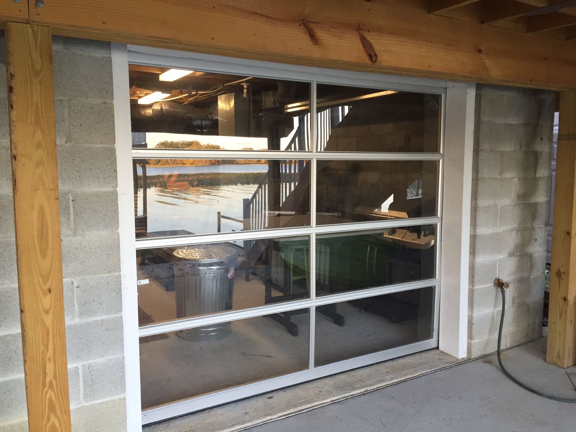 A garage door with a lot of windows and a wooden frame.