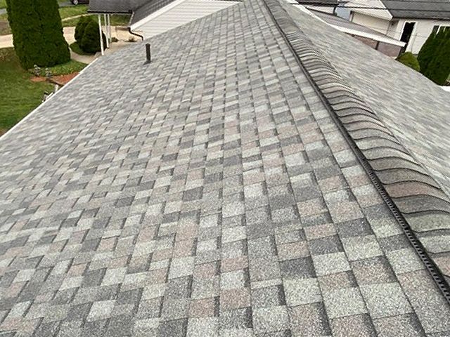 A close up of a roof with shingles on it.