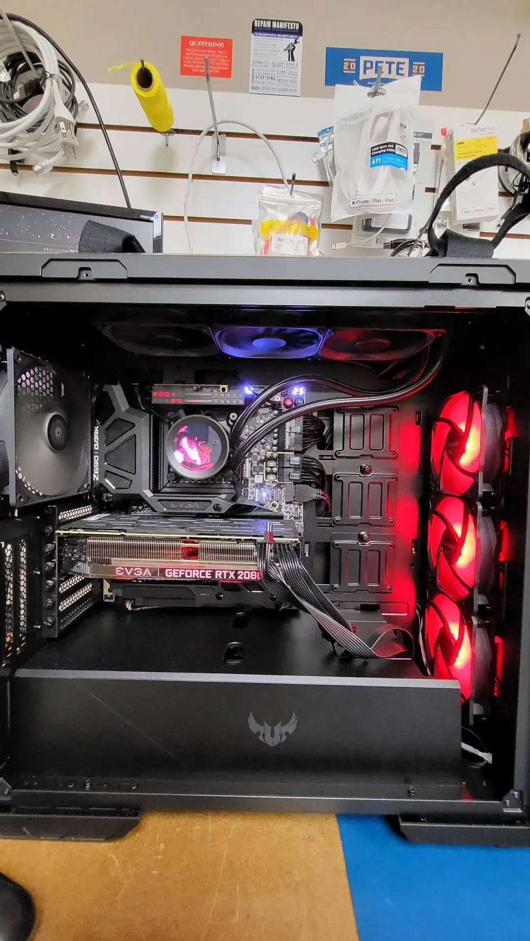 Inside view of a desktop computer case with red and blue LED lights illuminating components.