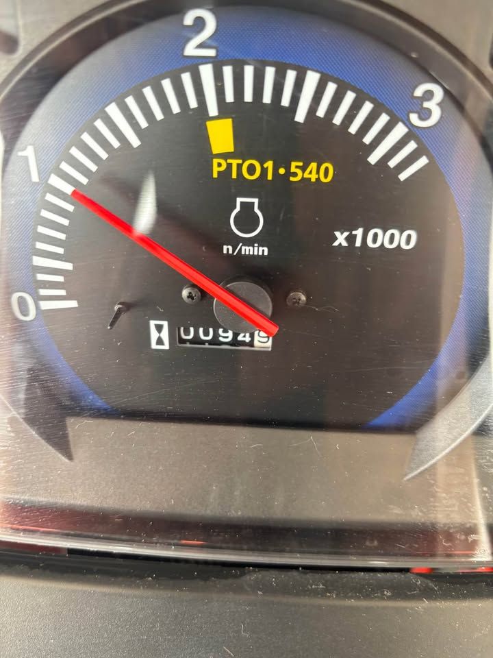 Tractor tachometer showing engine speed at approximately 800 RPM. The PTO is engaged. Odometer reads 00948.