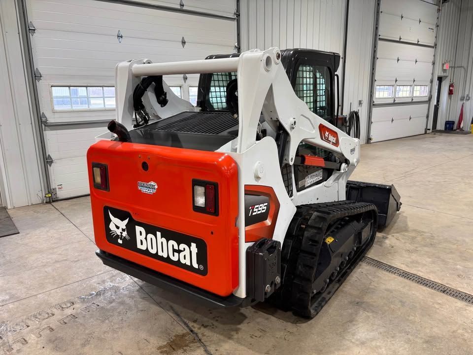 Bobcat T36 track loader, white and orange, indoors.