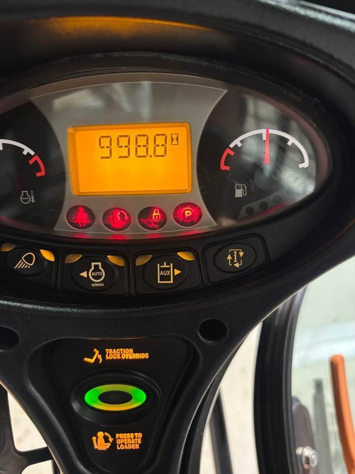 Dashboard showing 998.0 hours, fuel gauge, and various warning lights illuminated.