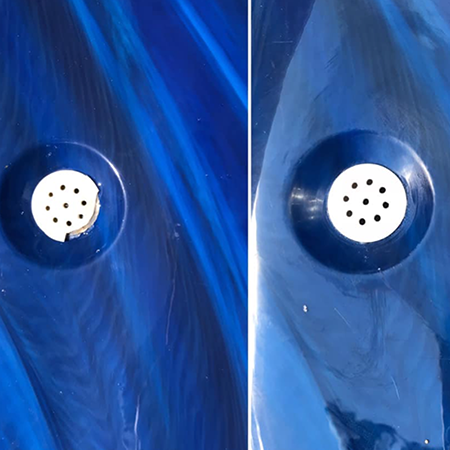 A hot tub with a brown cover is sitting in front of a house.