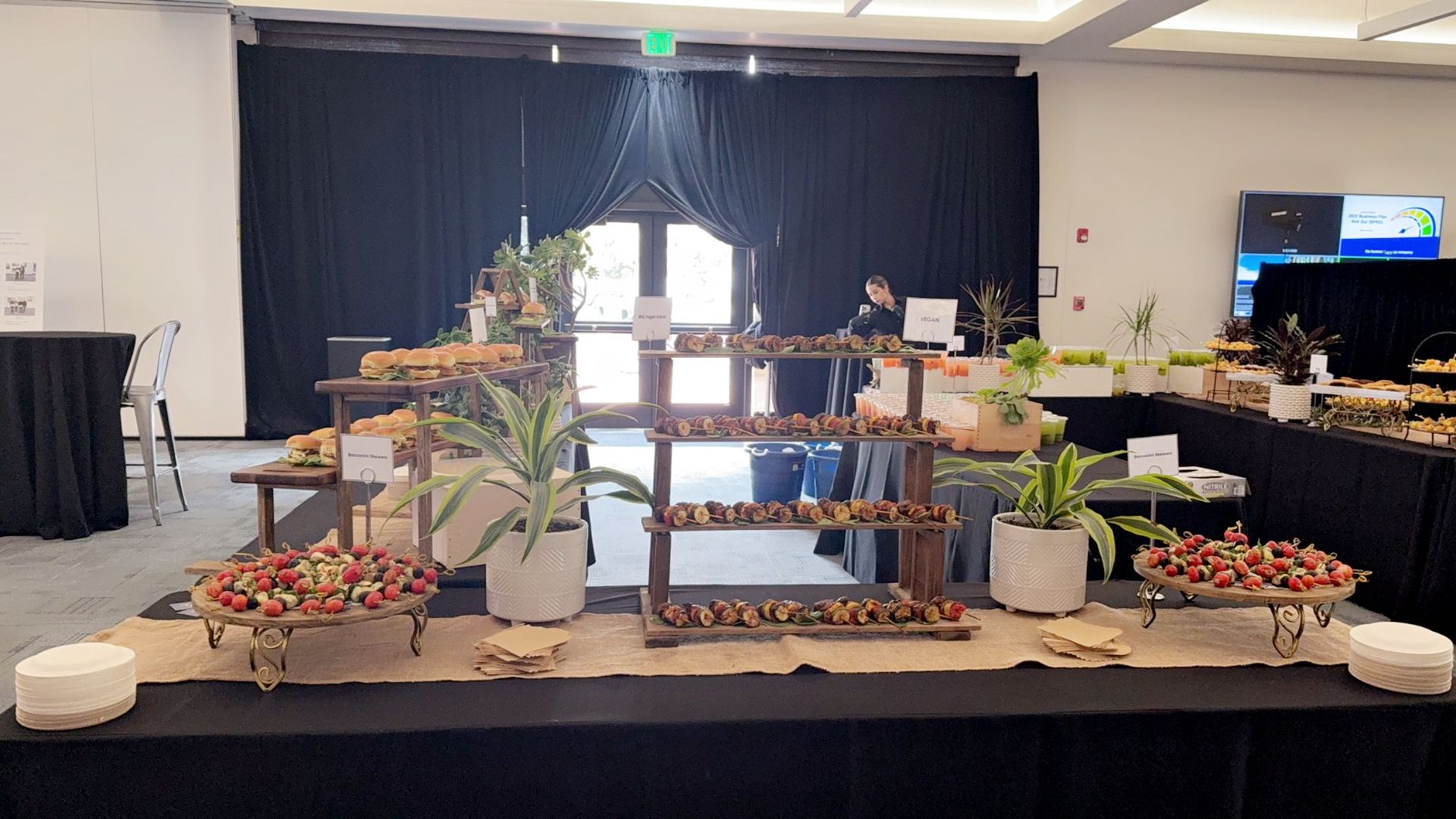 A buffet table with a lot of food on it in a room.