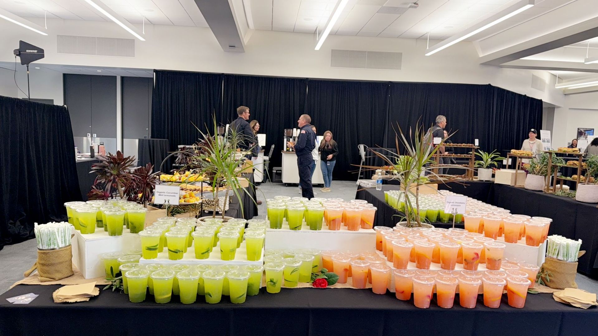 A buffet table filled with lots of different types of drinks.
