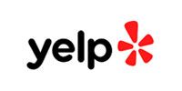 Yelp logo with black text and a red asterisk-like icon on a white background