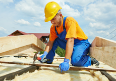 Man working on house construction