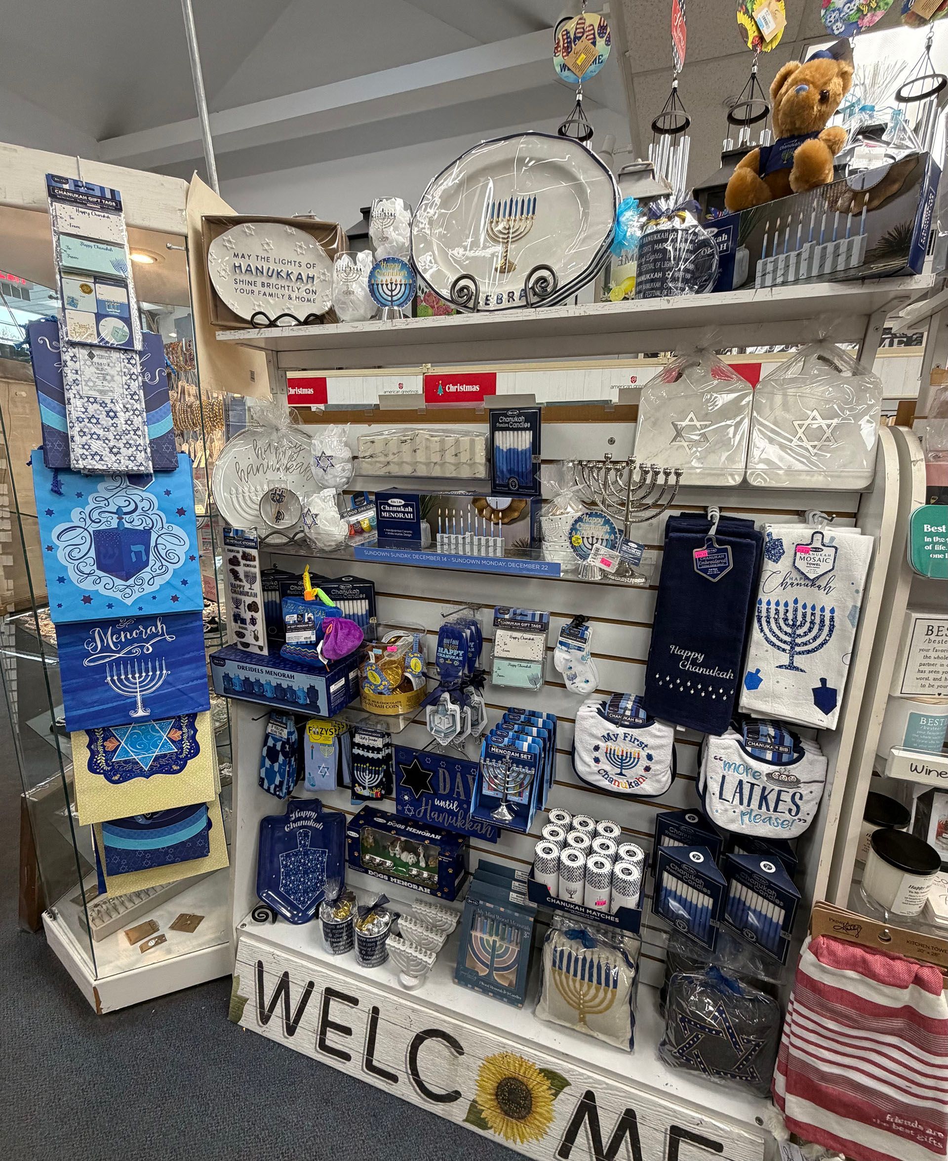 Shelf display of blue and white Hanukkah merchandise in a store.