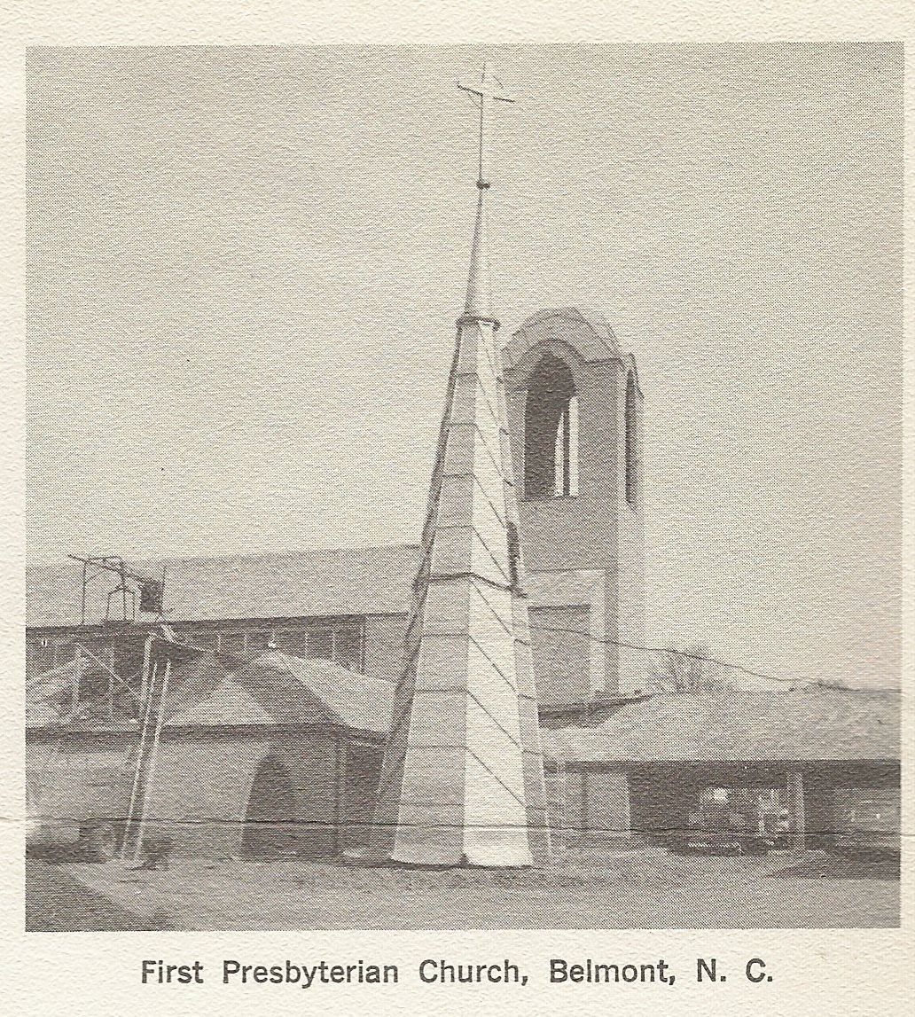 First Presbyterian Church in Belmont, North Carolina, with a tall steeple and arched bell tower. The church is a light color, with a cross at the top of the steeple.