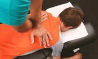 Chiropractic service on a young boy