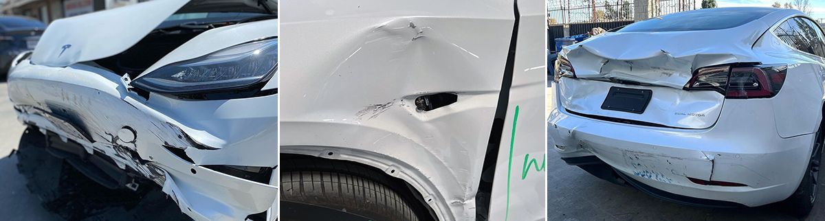 A white car with a damaged hood and fender is parked on the side of the road.