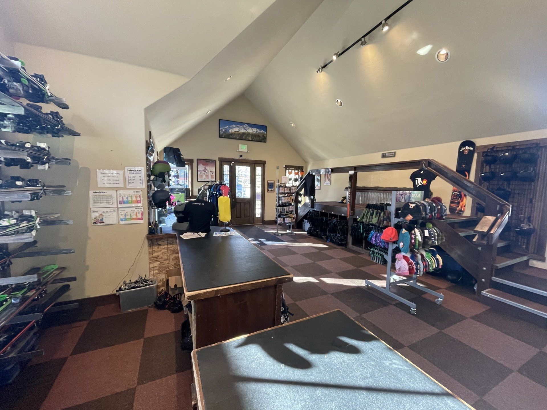 A large room with a vaulted ceiling and a table in the middle of it.