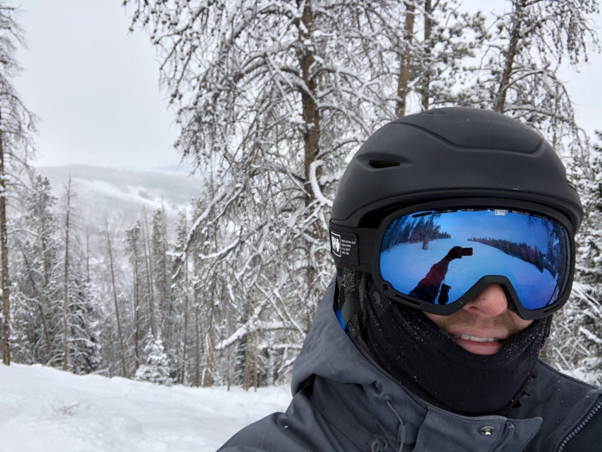 Skier smiling while skiing Breckenridge Resort.