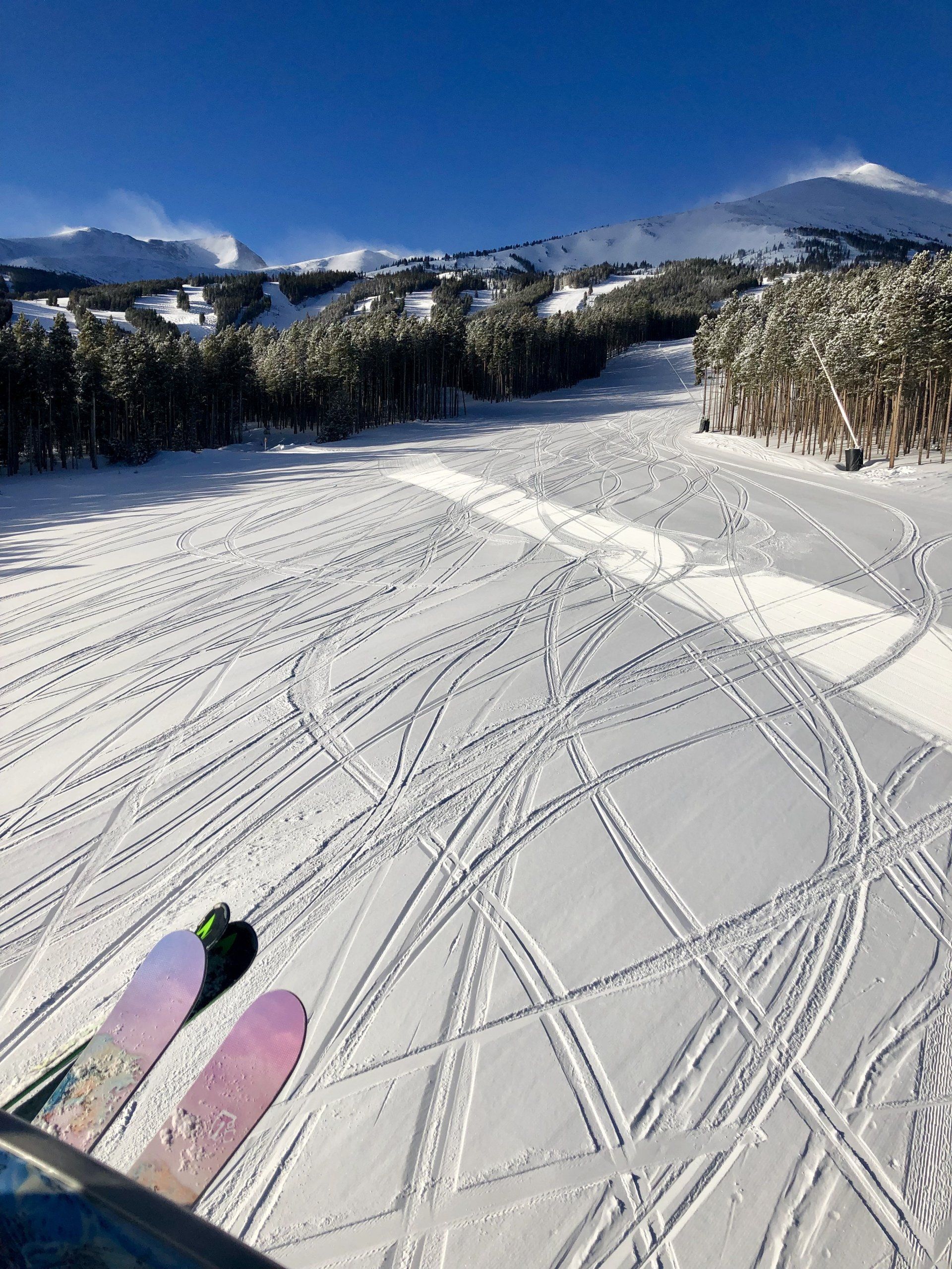 Fresh ski tracks in the snow in Breckenridge, CO.