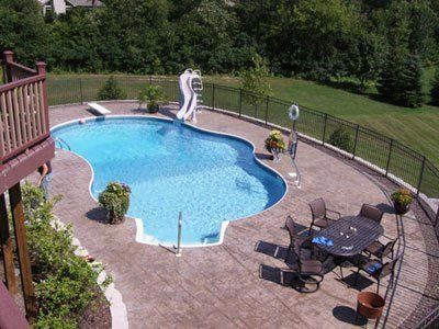 An aerial view of a large swimming pool with a slide