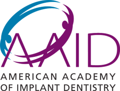 AAID logo: purple letters with a person shape and blue swirl, “American Academy of Implant Dentistry” below.