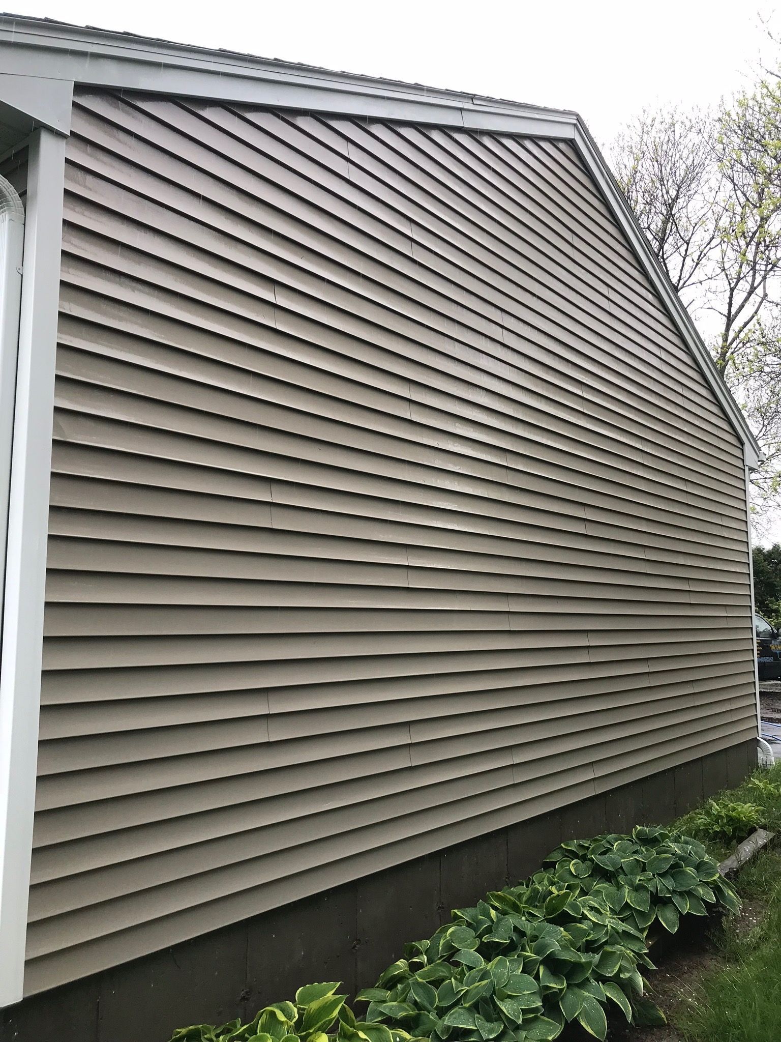 The side of a house with a lot of siding on it.