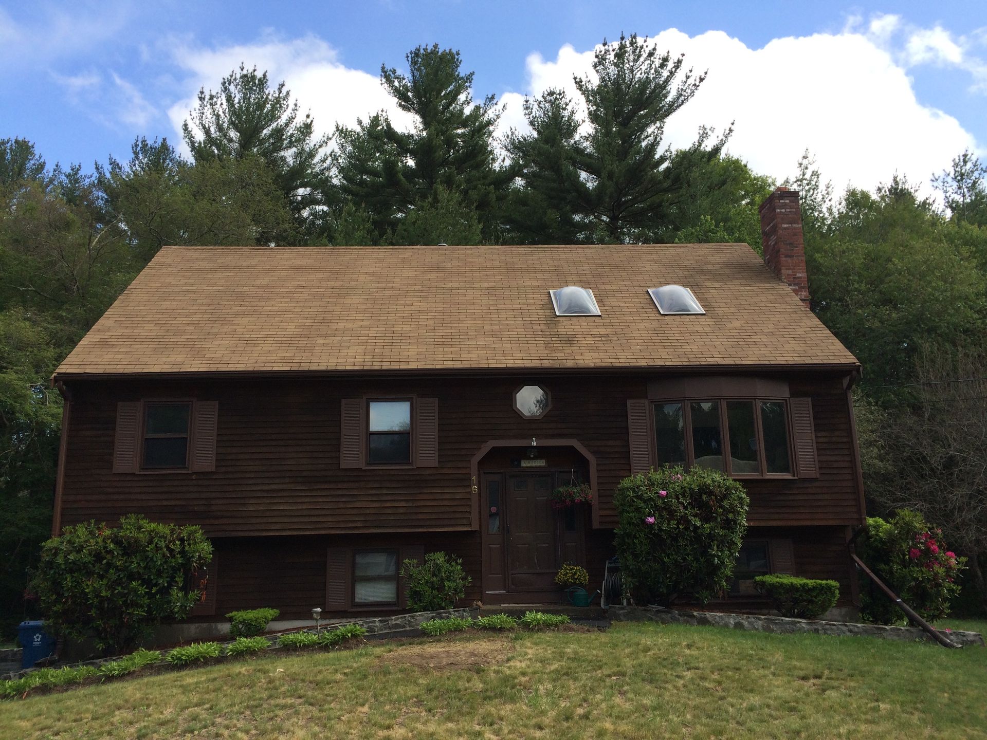 A house with a roof that has a skylight on it