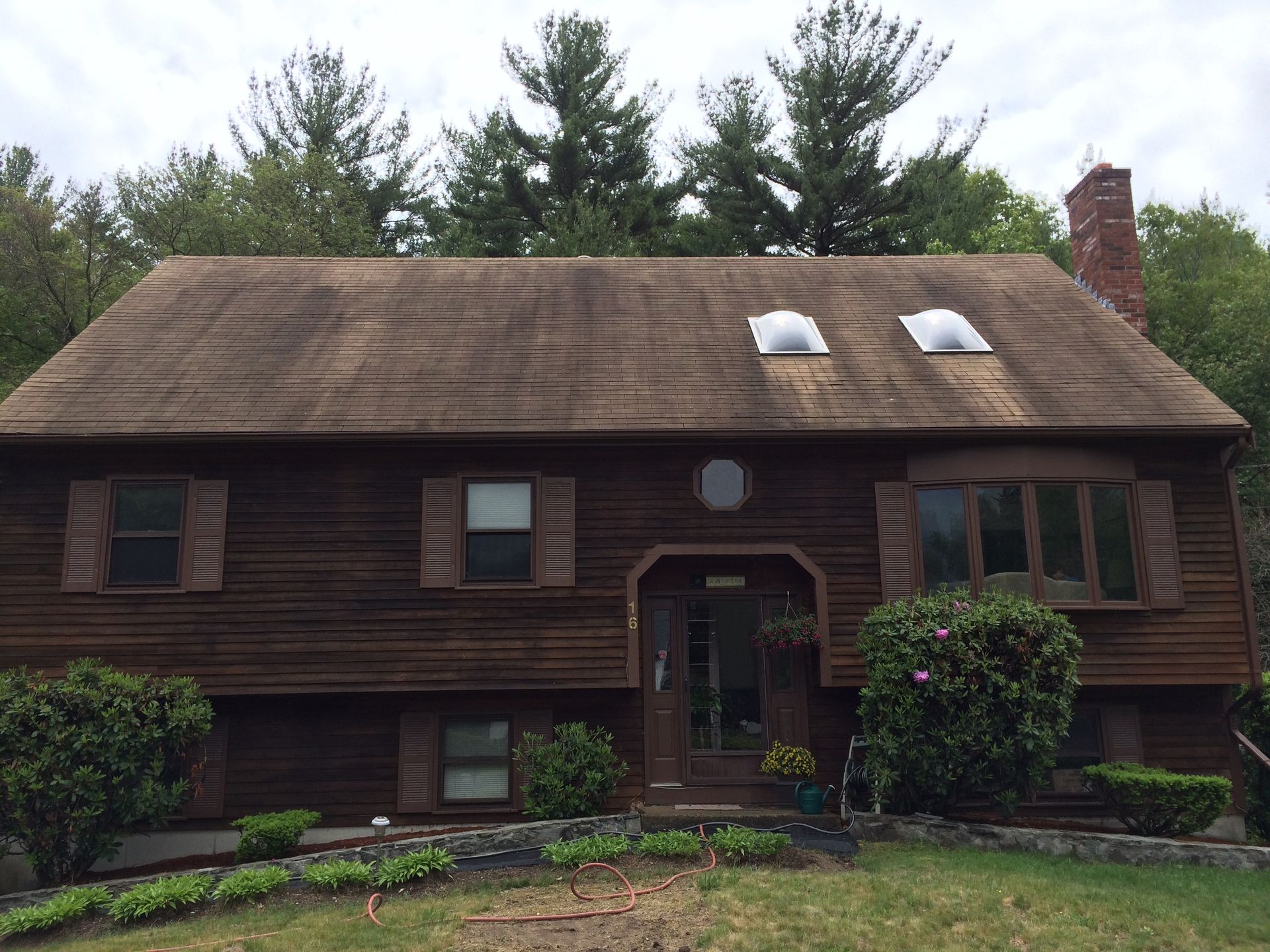 A house with a roof that has two skylights on it