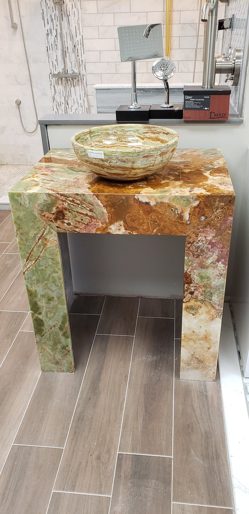 A bathroom vanity with a sink on top of it.
