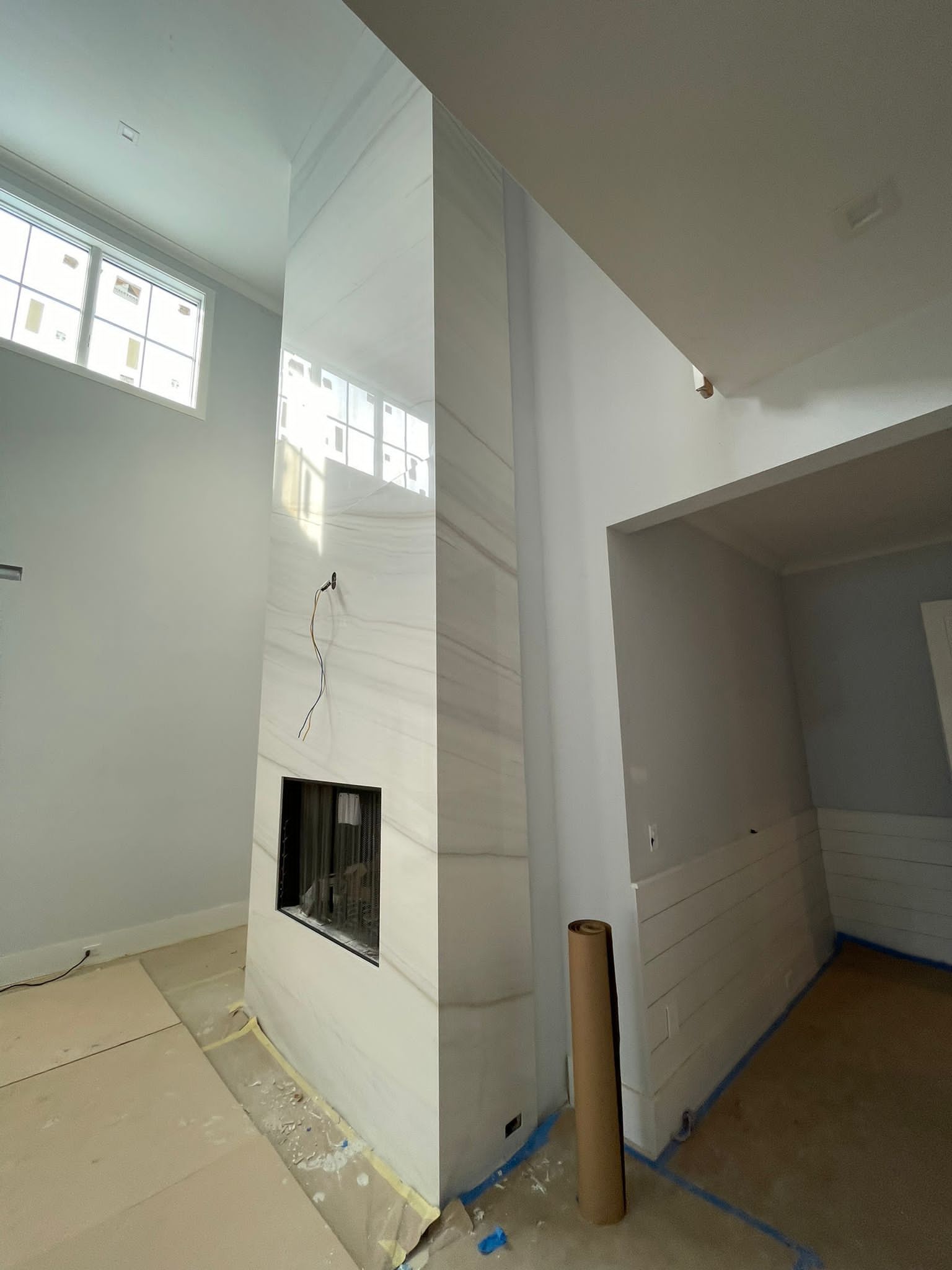 There is a fireplace in the middle of the room.